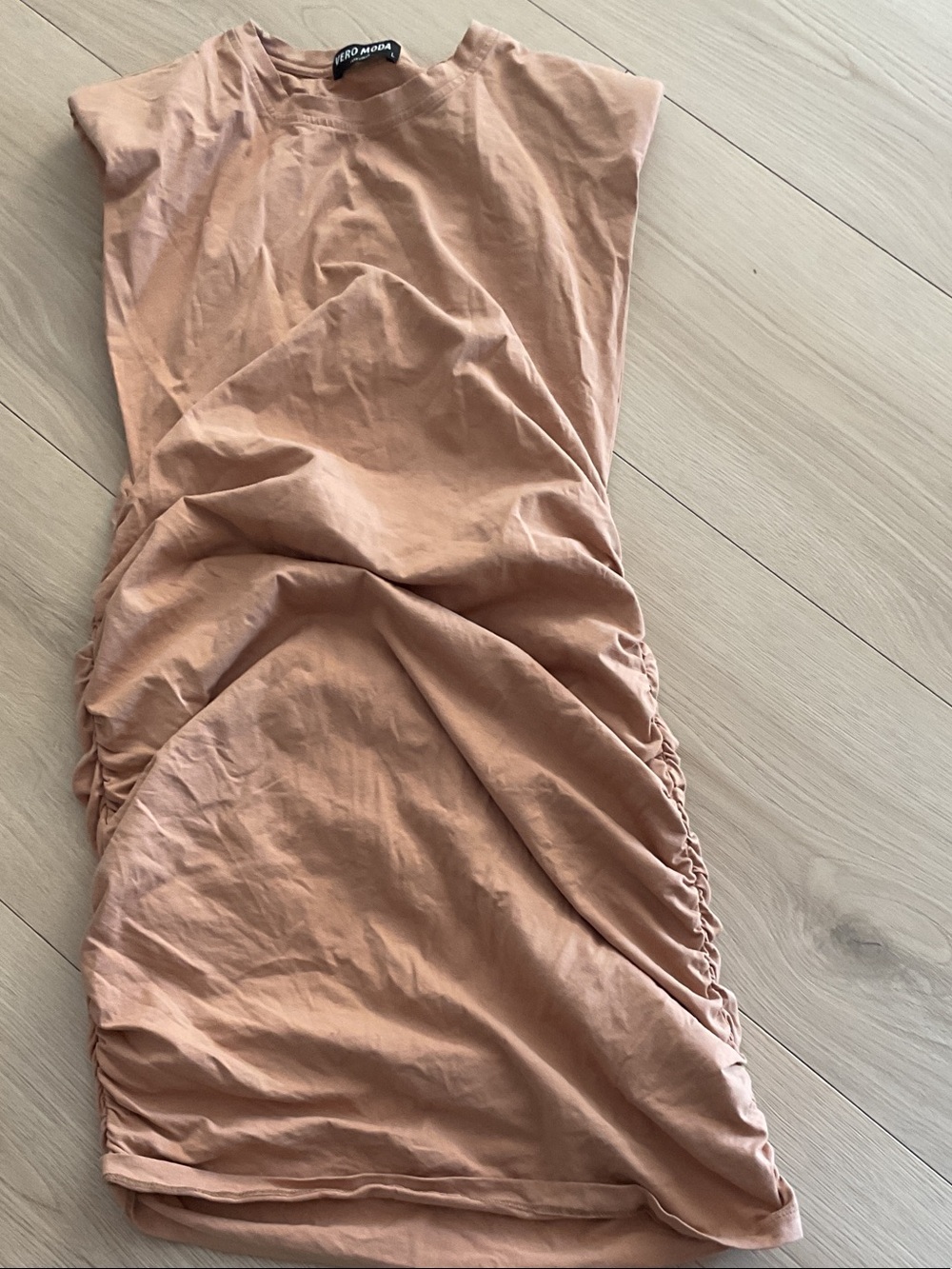 The dress is machine wash warm and tumble dry